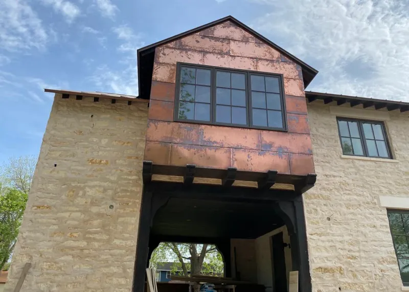 Copper metal panel facade on a stone building for Skylight Installation in La Mesa